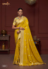 A full-length view of the model in Vanya Sarees' stunning yellow crushed georgette saree with a designer floral print blouse.