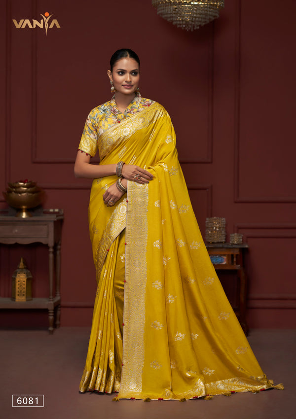 A full-length view of the model in Vanya Sarees' stunning yellow crushed georgette saree with a designer floral print blouse.