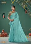 A full-length view of the model in Vanya Sarees' chic aqua blue georgette saree with a multi-color collared blouse.