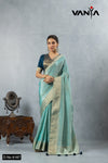 A full-length view of the model in Vanya Sarees' elegant aqua blue tissue silk saree with a designer embroidered blouse.
