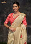 A beautiful close-up of the model in a Vanya Sarees Banarasi saree, highlighting the rich Meenakari work and the red designer blouse.