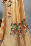 A detailed close-up of the pallu of the Vanya Sarees saree, highlighting the intricate, multi-color hand-embroidery of birds and flowers.
