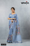 A full-length view of the model in Vanya Sarees' artistic periwinkle blue linen silk saree with a modern floral print.