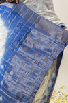 A close-up detail shot of the pallu of the Vanya Sarees Chanderi saree, showing the rich blue dye over the intricate zari weave.