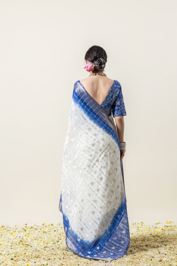 Full back view of the model in the Vanya Sarees ensemble, highlighting the tie-dye pallu and the alluring deep V-back of the embroidered blouse.