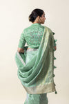 A stylish shot from the back showing the rich drape of the Vanya Sarees Chanderi pallu and the embroidered designer blouse.