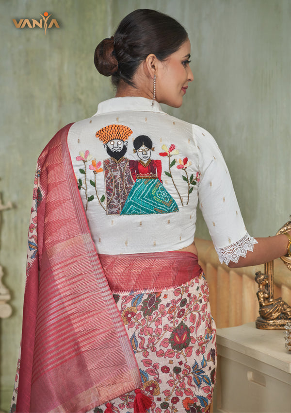 The stunning statement back of the designer blouse from Vanya Sarees, featuring a large, hand-embroidered motif of a traditional Indian couple.