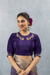 A clear view of the unique designer blouse from Vanya Sarees, showing the hand-embroidered Peter Pan collar and puff sleeves.