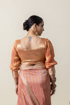 The elegant back view of the Vanya Sarees designer blouse, showcasing the U-neckline and puff sleeve silhouette.