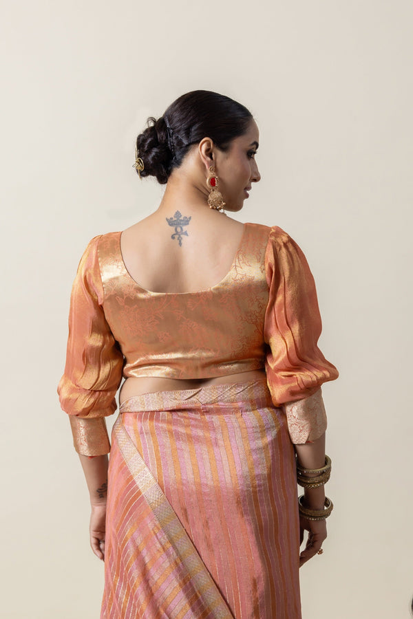 The elegant back view of the Vanya Sarees designer blouse, showcasing the U-neckline and puff sleeve silhouette.