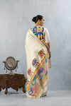 A full back view of the model in the Vanya Sarees ensemble, displaying the elephant print pallu and the statement appliqué blouse.