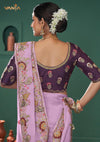 The stunning back view of the Vanya Sarees ensemble, showcasing the heavy floral embroidery on the pallu and the rich plum designer blouse.