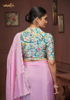 The stunning back view of the Vanya Sarees designer blouse, showcasing the rich multi-color floral and bird print and decorative buttons.
