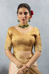 A clear front view of the Vanya Sarees readymade designer blouse in gold brocade, showing the V-neck and rich texture.