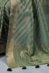A close-up of the Vanya Sarees saree, showing the intricate gold zari weave of the traditional Banarasi border.