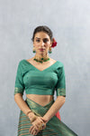 A clear front view of the Vanya Sarees readymade designer blouse in Rama Green, showing the elegant V-neckline.