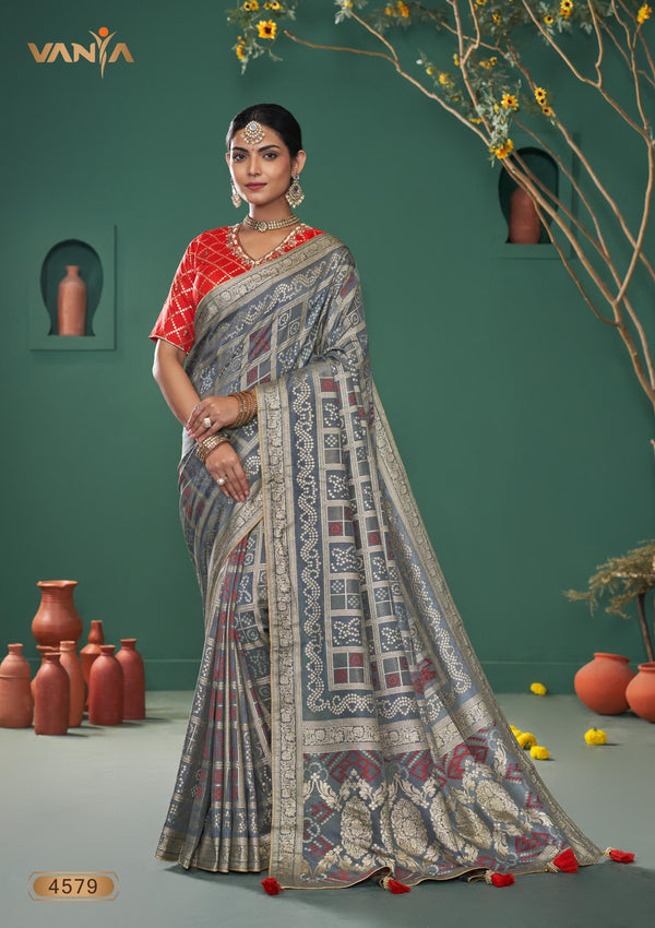 A full-length front view of the model in Vanya Sarees' magnificent grey Banarasi silk saree with a Patola-inspired weave.