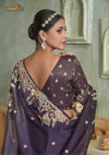 The stunning back view of the Vanya Sarees ensemble, showcasing the heavy, multi-color embroidery on the pallu and the deep V-back of the blouse.
