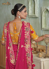 The stunning back view of the Vanya Sarees ensemble, showcasing the heavy, multi-color embroidery on the pallu and the designer back of the yellow blouse.