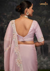 The stunning back view of the Vanya Sarees ensemble, showcasing the heavy floral embroidery on the pallu and the deep V-back of the designer blouse.