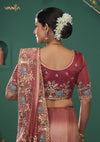 The elegant back view of the Vanya Sarees ensemble, showcasing the heavy floral embroidery on the pallu and the intricately embroidered designer blouse.