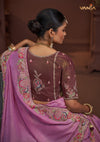 The elegant back view of the Vanya Sarees ensemble, showcasing the heavy embroidery on the pallu and the designer back of the plum blouse.