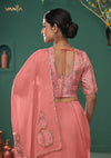 The stunning back view of the Vanya Sarees ensemble, showcasing the heavy floral embroidery on the pallu and the elegant designer blouse.