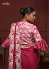 The stunning back view of the Vanya Sarees ensemble, showcasing the heavy floral embroidery on the pallu and the designer bell sleeve blouse.