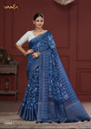 A full-length view of the model in Vanya Sarees' artistic indigo blue linen cotton saree with a traditional folk art print.