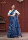 An elegant standing pose of the model showcasing the complete designer look of the Vanya Sarees indigo printed saree and mirror work blouse.
