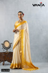 A full-length view of the model in Vanya Sarees' stunning ivory and yellow ombre tissue silk saree with a designer puppet blouse.