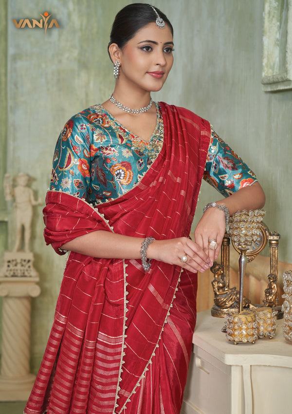 A beautiful close-up of the model in a Vanya Sarees saree, highlighting the rich, painterly Kalamkari-style print on the designer blouse.