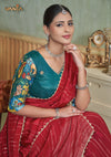 A beautiful close-up of the model in a Vanya Sarees saree, highlighting the rich, painterly Kalamkari-style print on the designer blouse.