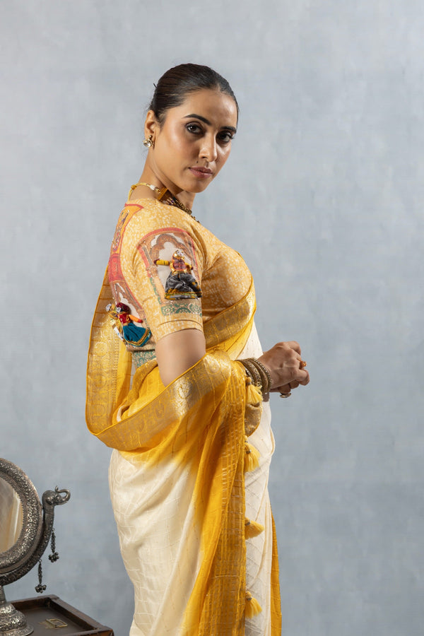 A detailed side profile of the model in a Vanya Sarees saree, showing the unique 3D puppet and printed motif on the designer blouse sleeve.
