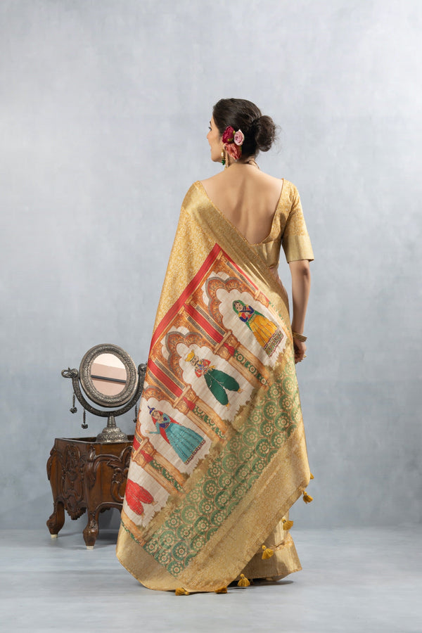 A full back view of the model displaying the magnificent, artistic Kathputli print on the pallu of the Vanya Sarees silk saree.