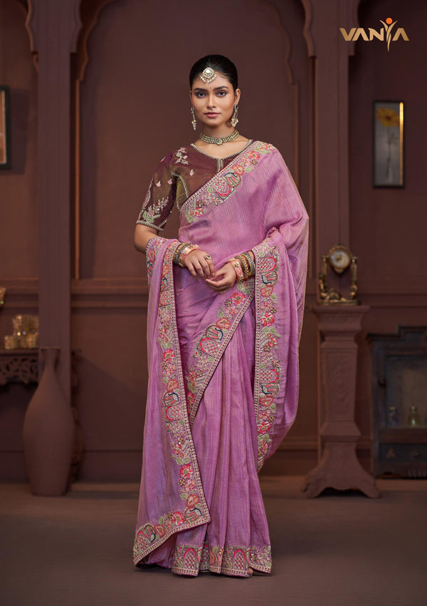 A beautiful full view of the model in a Vanya Sarees lavender saree, highlighting the rich floral and peacock embroidery.
