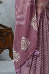 A detailed close-up of the pallu of the Vanya Sarees saree, showing the combination of Leheriya and rose prints with tassels.