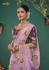 An graceful pose of the model showcasing the complete designer look of the Vanya Sarees lilac heavy embroidered saree.