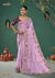 A full-length view of the model in Vanya Sarees' magnificent lilac silk saree with a heavy, multi-color embroidered border and plum blouse.