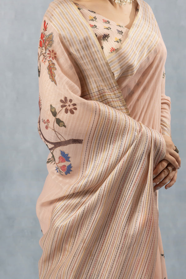A detailed close-up of the Vanya Sarees saree, highlighting the artistic bird print on the sleeve and the multi-color striped texture.