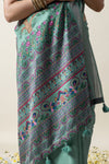 A detailed shot of the intricate Madhubani-style peacock and floral print on the pallu of the Vanya Sarees Tussar silk saree.