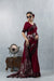 Vanya Maroon Saree side pose, showcasing the large metallic silver floral foil print motifs on the skirt and pallu.