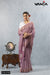 A full-length view of the model in Vanya Sarees' elegant mauve Leheriya print Kota Doria saree with a white designer blouse.