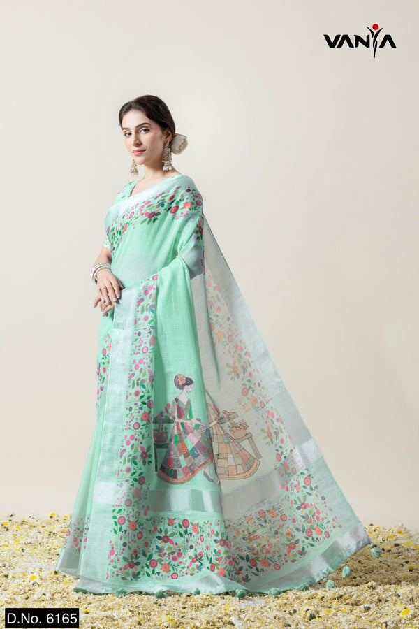Model in a graceful pose in the Vanya Sarees mint green linen silk saree, perfect for a day wedding look.