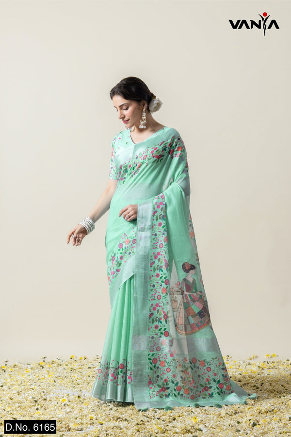 A full-length view of the model in Vanya Sarees' artistic mint green linen silk saree with a unique figurative print.