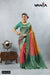 A full-length view of the model in Vanya Sarees' vibrant multi-color Bandhani print saree with a green Banarasi border.