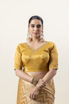 A clear front view of the readymade mustard gold designer blouse from Vanya Sarees, highlighting the hand-embroidered neckline.
