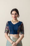 A clear front view of the Vanya Sarees navy blue designer blouse, showing the V-neck and rich brocade sleeves.
