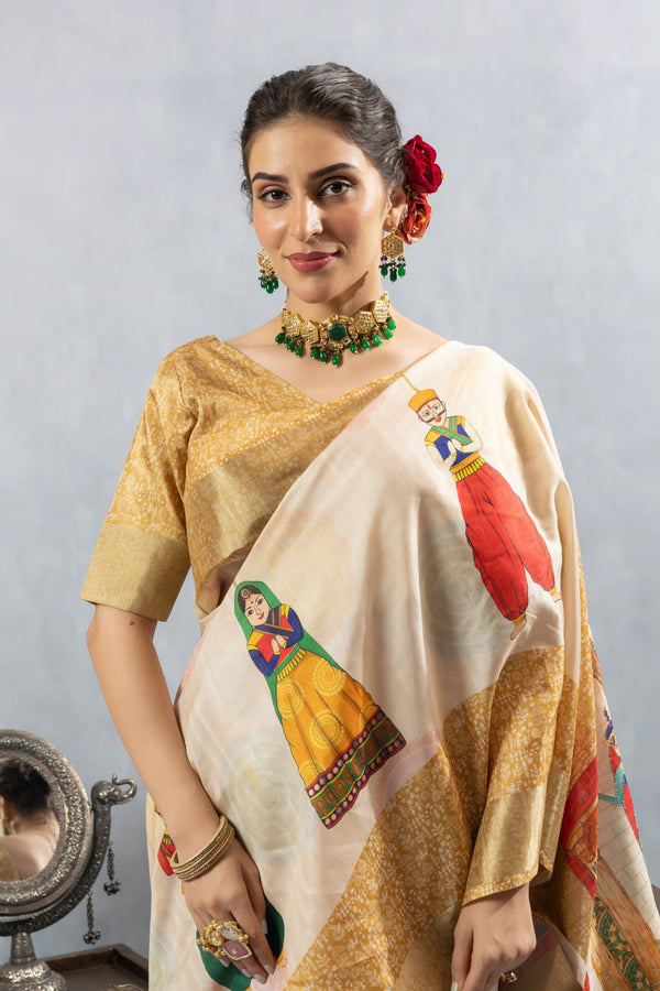 A close-up of the model wearing the Vanya Sarees off-white silk saree, highlighting a puppet motif on the shoulder.