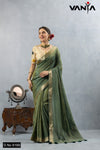 A full-length view of the model in Vanya Sarees' elegant olive green crushed tissue silk saree with a designer appliqué blouse.
